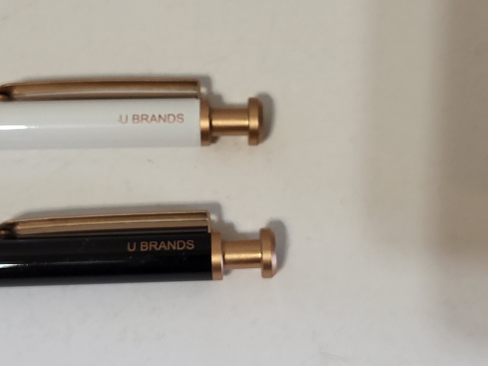 U Brands pens- 2 count, 1 black, 1 white, gold color trim
