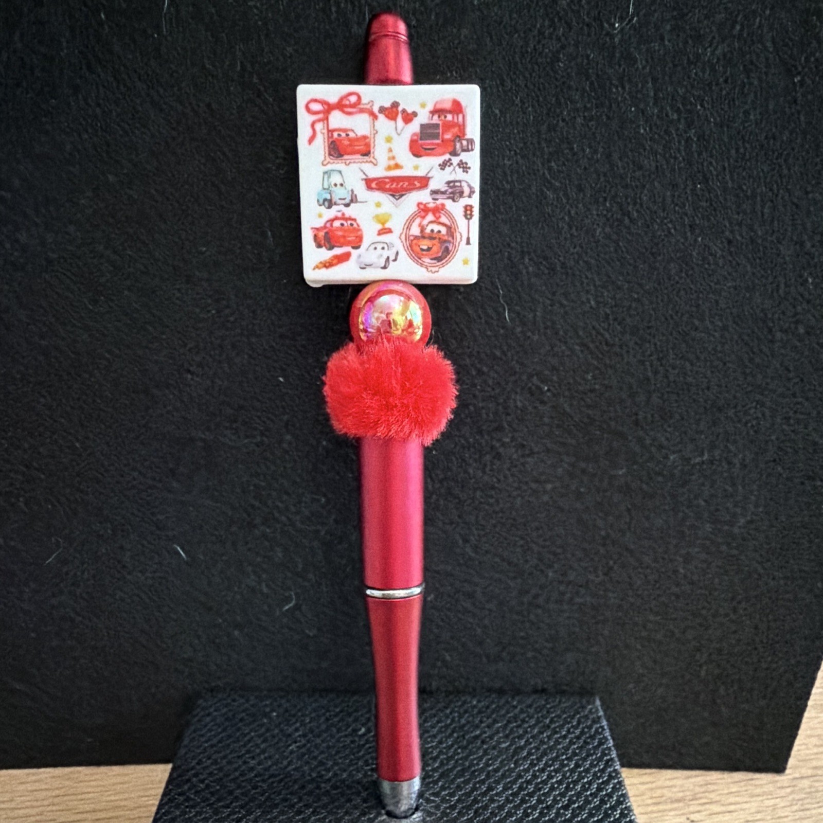 Red Plastic Novelty Ballpoint Pen w/ Pom-Pom & Cartoon Topper, Black Ink