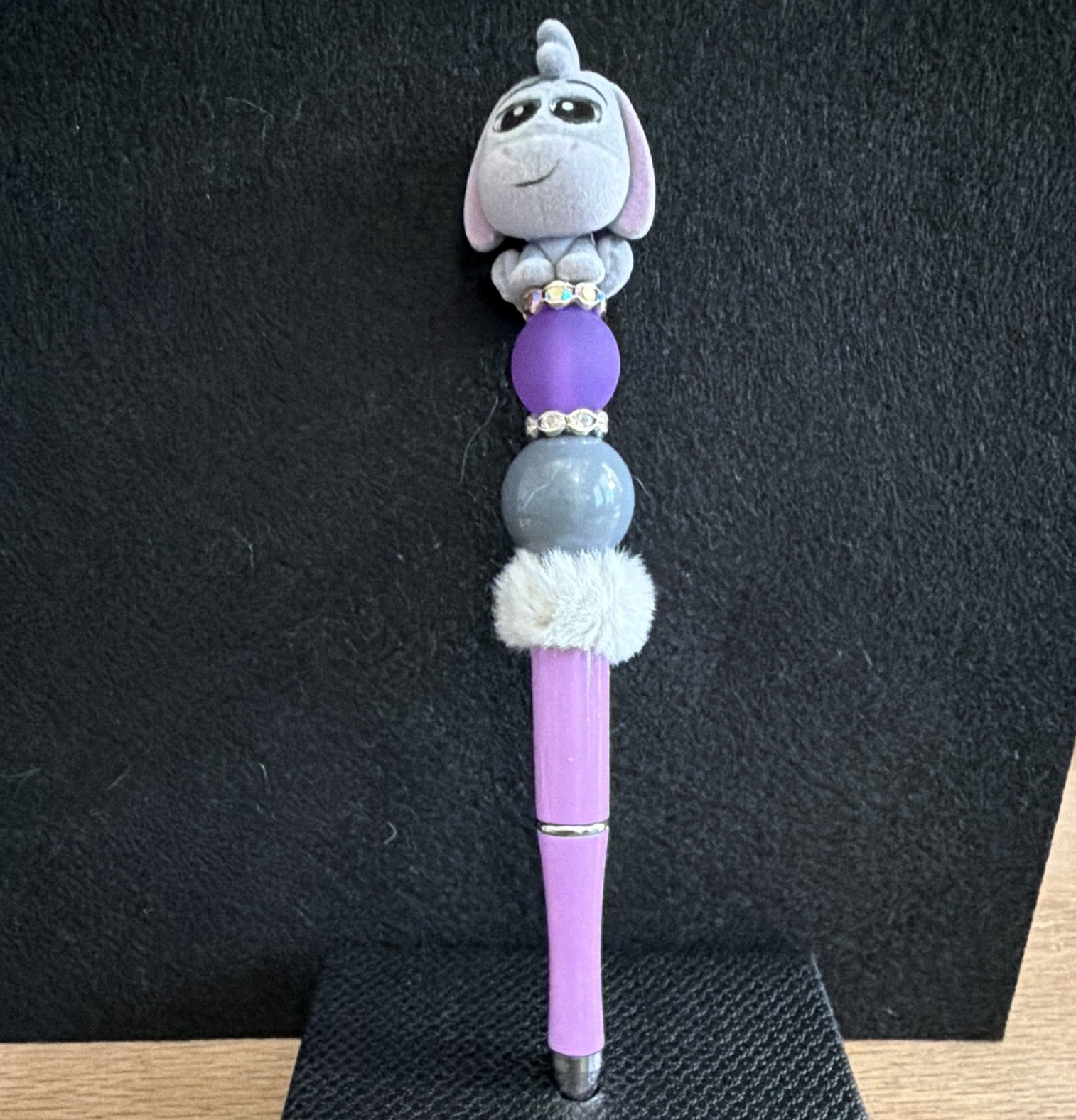 Purple Plastic Ballpoint Pen w/ Eeyore Topper, Beads & Pom-Pom, black Ink