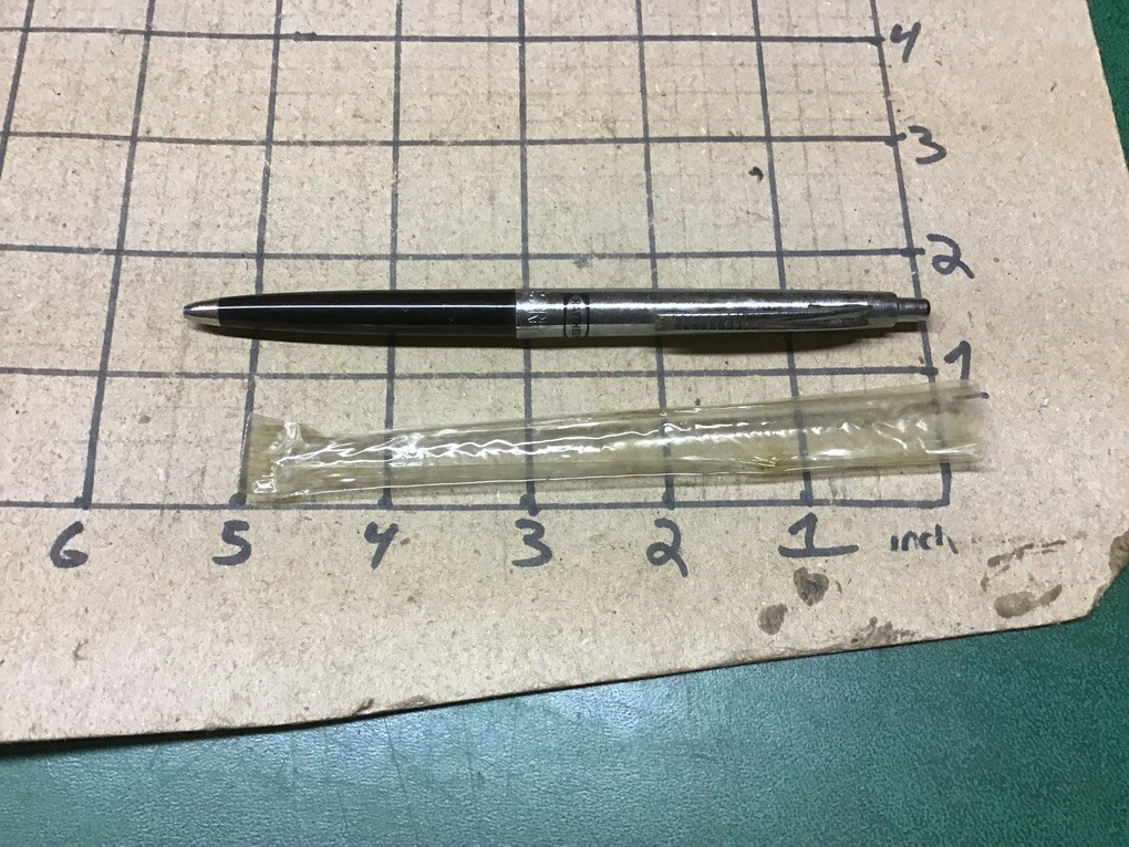unused Branded RAYTHEON PEN – w plastic cover, ink is dry, some surface marks