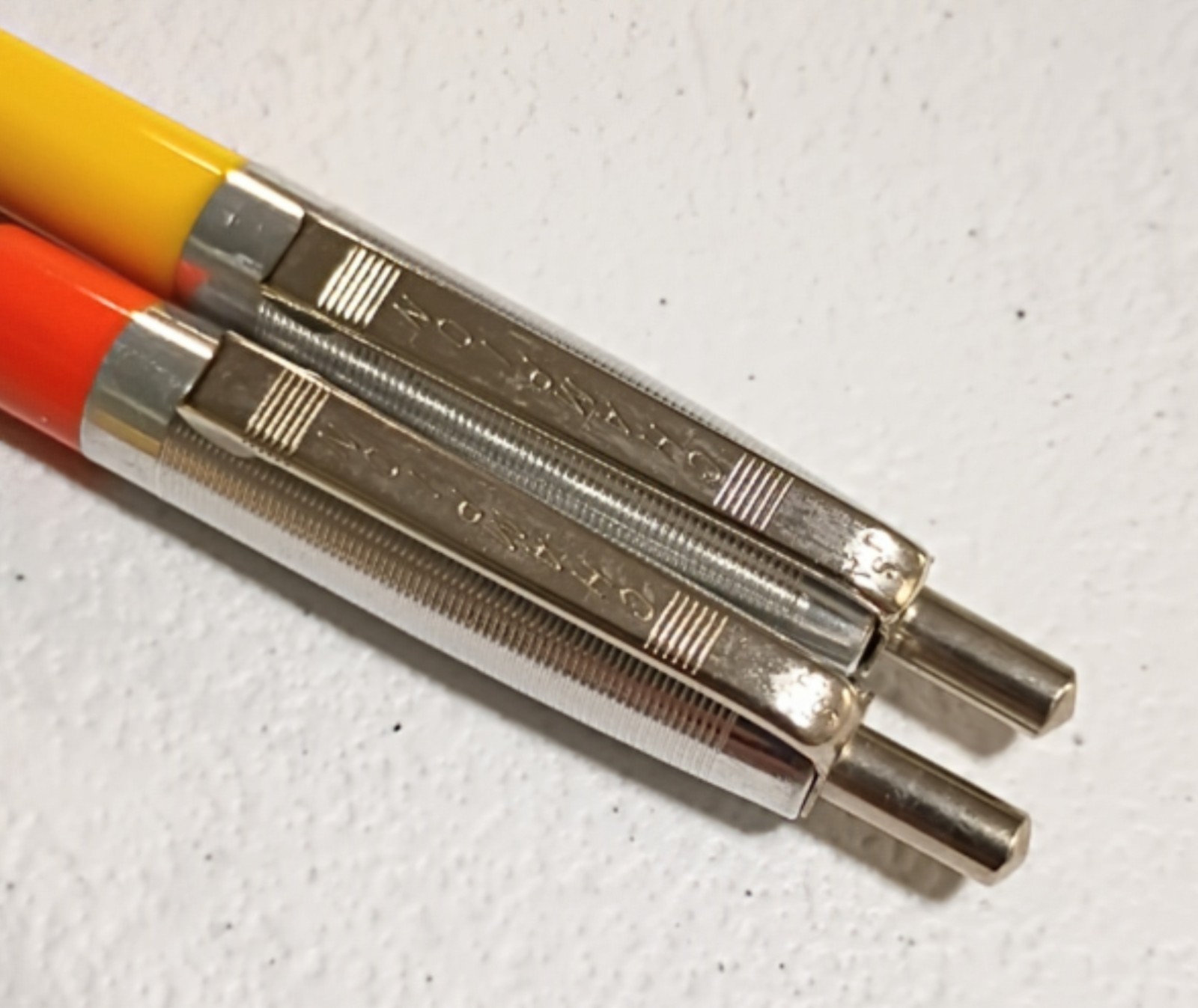 Lot of 2 Vintage Champion Ballpoint Pens Cat Father & Solid Yellow
