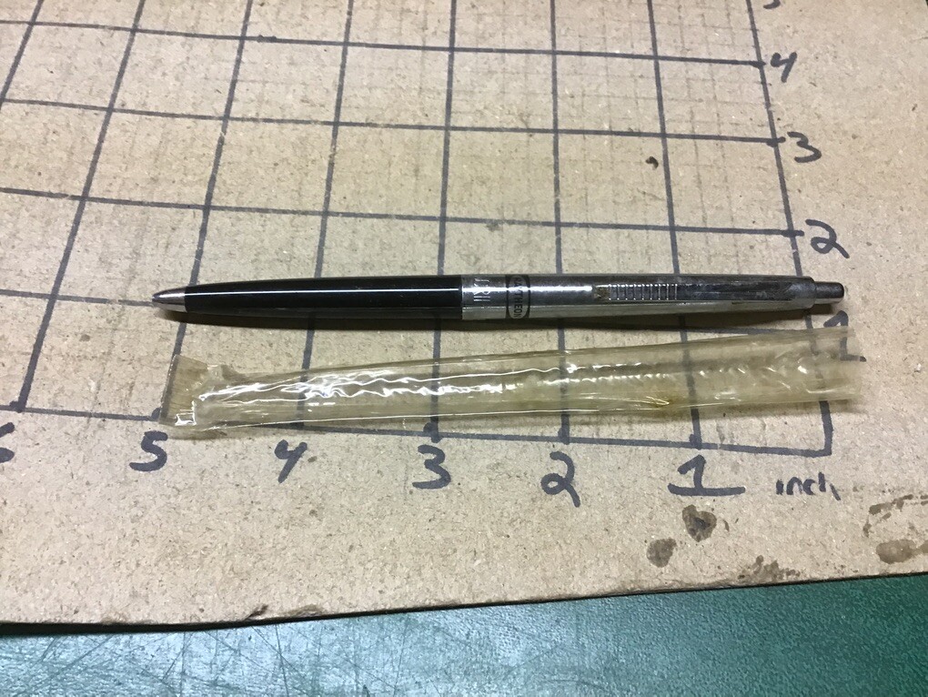 unused Branded RAYTHEON PEN – w plastic cover, ink is dry, some surface marks