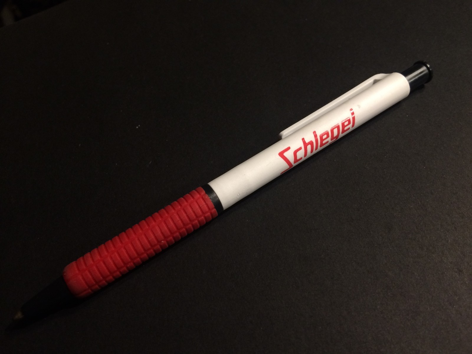 PEN SCHLEGEL BALL POINT PEN RUBBER GRIP COLOR: RED AND WHITE SOLD AS IS